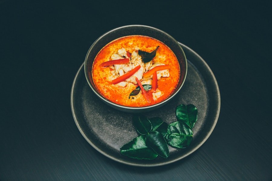Thai vegetable curry served with rice and fresh herbs